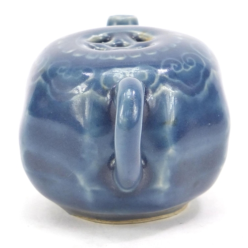 2109 - Chinese porcelain blue glazed water pot with ruyi head border, 8cm in length