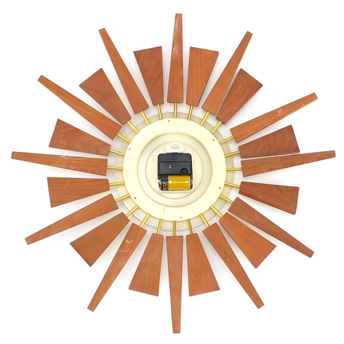 83 - Mid century design teak sunburst design wall clock by Anstey Wilson, 51cm in diameter