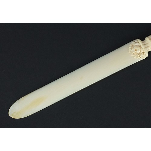 606 - Victorian carved ivory page turner finely carved with foliage, 24.5cm in length