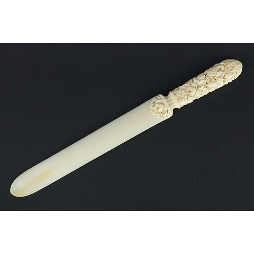 606 - Victorian carved ivory page turner finely carved with foliage, 24.5cm in length