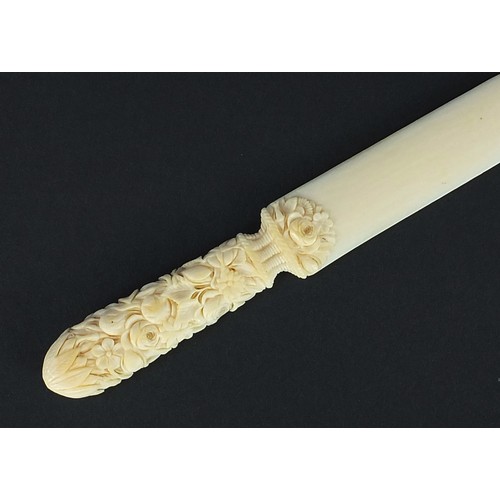 606 - Victorian carved ivory page turner finely carved with foliage, 24.5cm in length