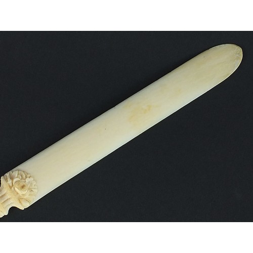 606 - Victorian carved ivory page turner finely carved with foliage, 24.5cm in length