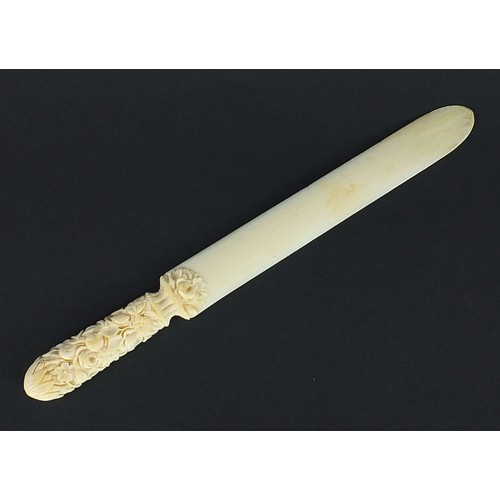 606 - Victorian carved ivory page turner finely carved with foliage, 24.5cm in length