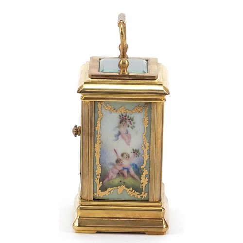 614 - Miniature brass perpetual carriage clock with Sevres type porcelain panels, 7.5cm high