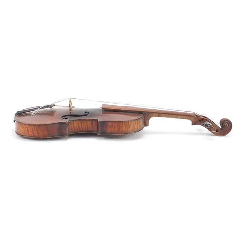 843 - Old wooden violin bearing an Antonius Stradivarius paper label, the violin back 11.75 inches in leng... 