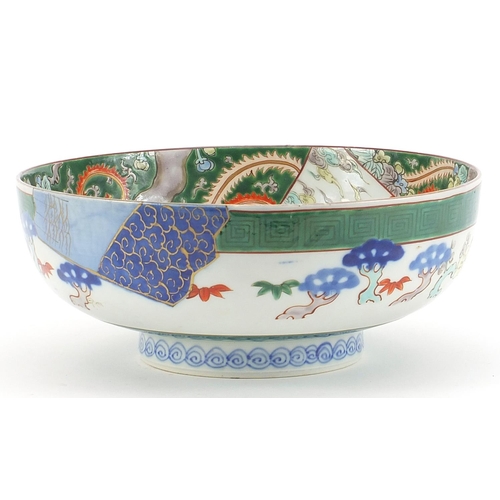 642 - Japanese porcelain bowl hand painted with a dragon amongst clouds, character marks to the underside,... 