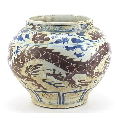 738 - Large Chinese porcelain temple jar hand painted with a dragon amongst clouds, 30cm high