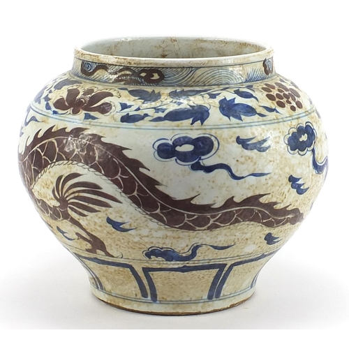 738 - Large Chinese porcelain temple jar hand painted with a dragon amongst clouds, 30cm high