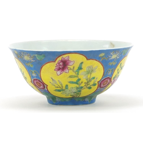 378 - Chinese porcelain blue ground bowl hand painted in the famille rose palette with flowers, four figur... 