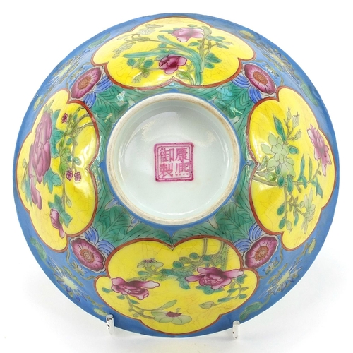 378 - Chinese porcelain blue ground bowl hand painted in the famille rose palette with flowers, four figur... 