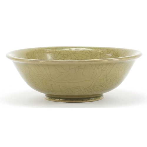 1836 - Chinese celadon glazed bowl incised with flowers, character marks to the base, 18cm in diameter