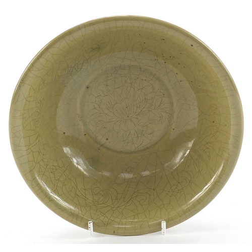 1836 - Chinese celadon glazed bowl incised with flowers, character marks to the base, 18cm in diameter