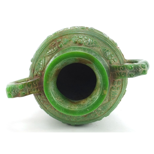 755 - Chinese archaic style carved green jade vase with twin dragon handles, 17.5cm high