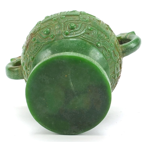 755 - Chinese archaic style carved green jade vase with twin dragon handles, 17.5cm high