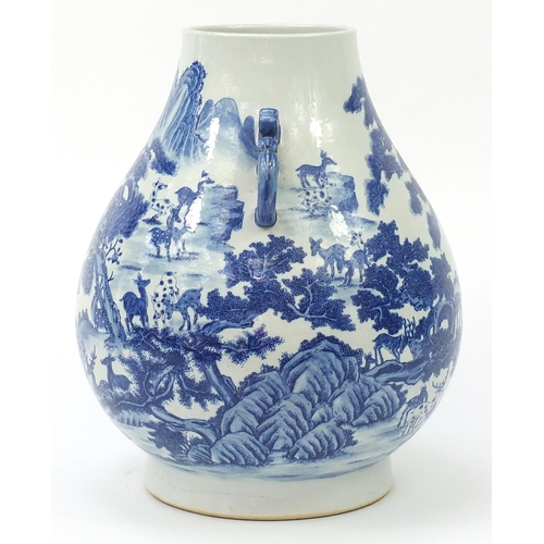 369 - Very large Chinese blue and white porcelain arrow vase with ears, finely hand painted with deer in a... 