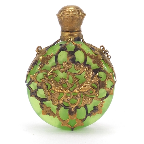 118 - Antique green glass scent bottle with brass foliate overlay, 6.5cm high