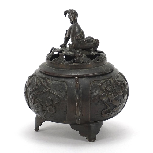 756 - Chinese patinated bronze tripod incense burner with twin handles, 12cm high