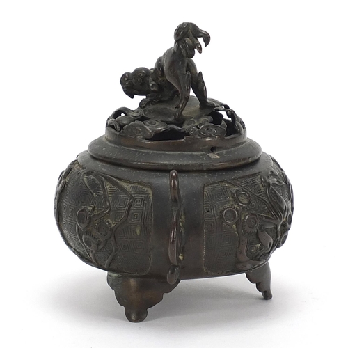 756 - Chinese patinated bronze tripod incense burner with twin handles, 12cm high