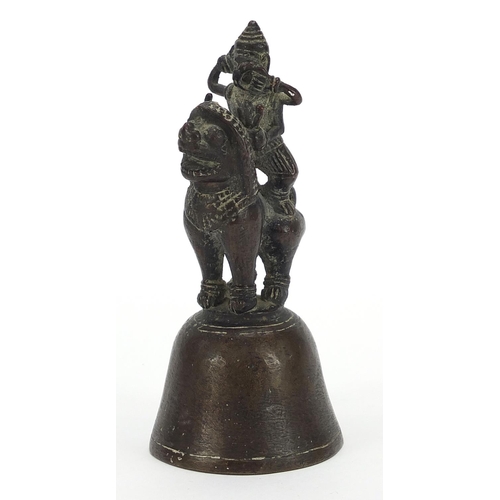 1805 - Indian bronze bell in the form of a deity on mythical animal, 12cm high