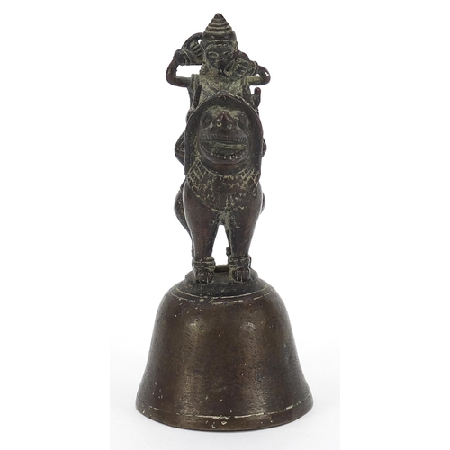 1805 - Indian bronze bell in the form of a deity on mythical animal, 12cm high