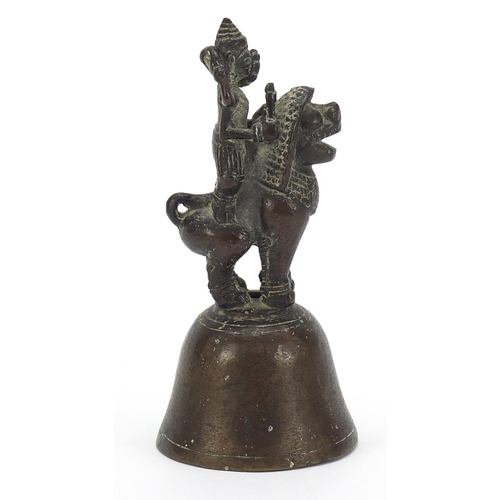 1805 - Indian bronze bell in the form of a deity on mythical animal, 12cm high