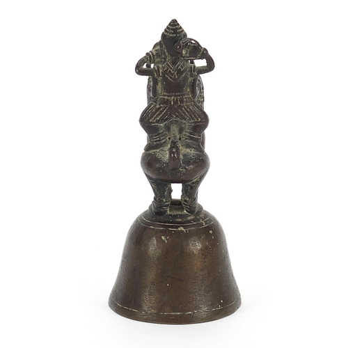 1805 - Indian bronze bell in the form of a deity on mythical animal, 12cm high