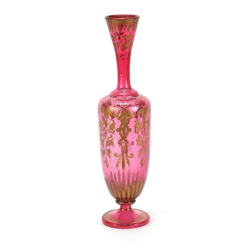 414 - 19th century cranberry glass vase gilded with flowers, 35cm high