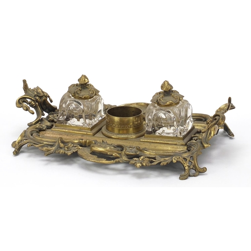 1801 - 19th century ornate brass desk stand with two glass inkwells, 32cm wide