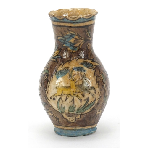 1846 - Islamic Iznik pottery vase hand painted with animals and flowers, 17.5cm high