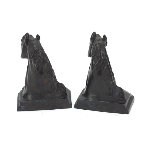 345 - Pair of patinated bronze horse head design bookends, each 14.5cm high