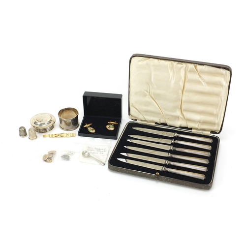 2002 - Objects including six silver handled butter knives, two silver thimbles and a pair of horseracing in... 