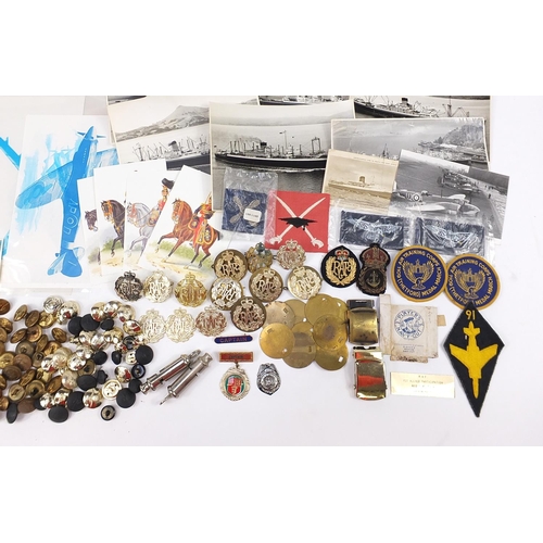 1934 - Militaria including Royal Air Force cap badges, buttons, cloth patches, Naval HMS Terror tally and e... 