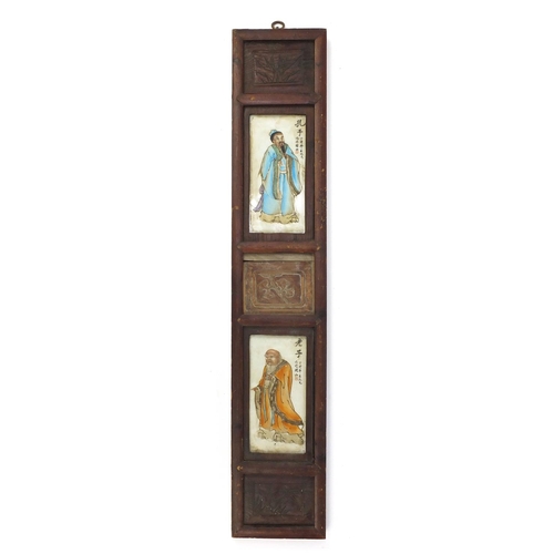 1914 - Two Chinese porcelain panels hand painted with figures, housed in a hardwood frame carved with flowe... 