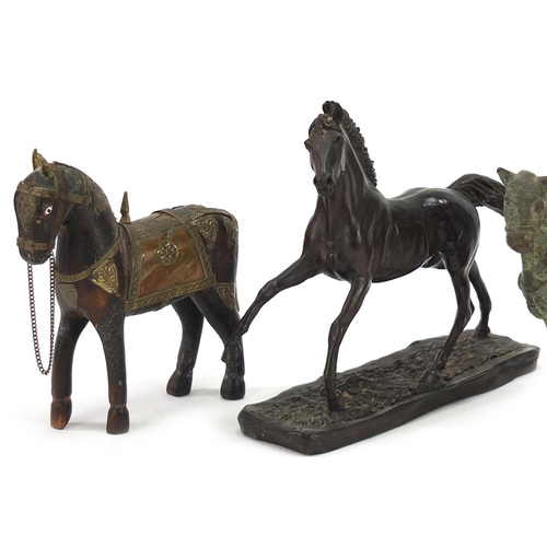 1902 - Four model horses including two Chinese archaic style examples, the largest 22cm in length