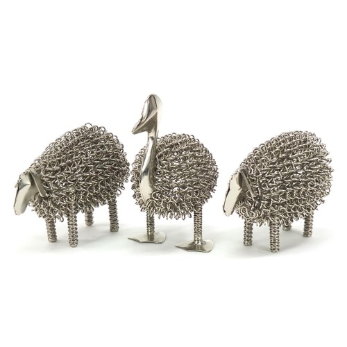 1827 - Three white metal animals comprising two sheep and a duck the largest 14cm high