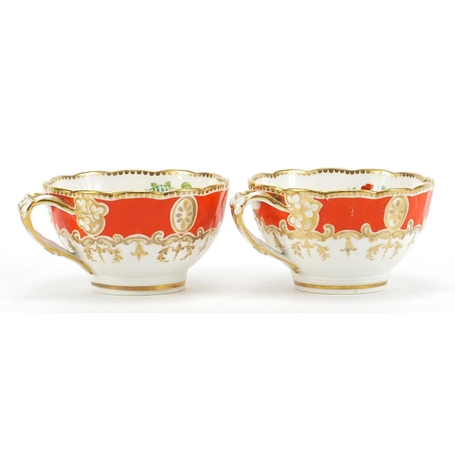 407 - Pair of 19th century porcelain cups and saucers finely hand painted with flowers, numbered 1743, eac... 