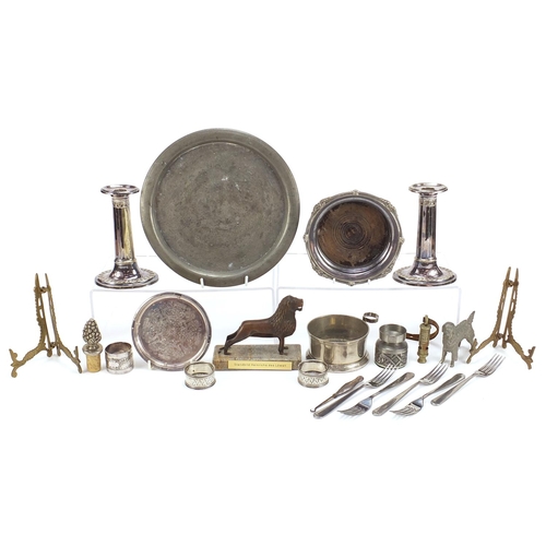 2008 - Metalware including a pair of silver napkin rings and pair of silver plated candlesticks, the larges... 