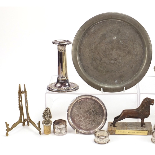 2008 - Metalware including a pair of silver napkin rings and pair of silver plated candlesticks, the larges... 