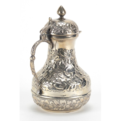 727 - Egyptian silver coffee pot embossed with flowers and foliage, impressed marks to the base, 15cm high... 