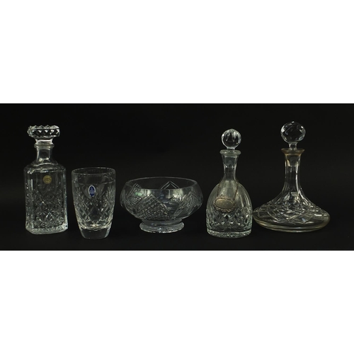 1009 - Cut crystal and glassware including three decanters and a Royal Doulton vase, the largest 25cm high