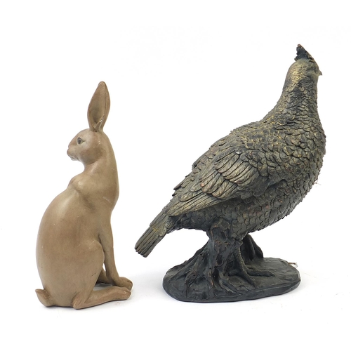 1011 - Decorative bronzed pheasant and a seated rabbit, the largest 35cm high