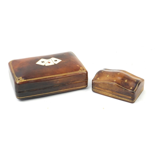 1007 - Tooled leather playing card box and one other, the largest 15cm wide