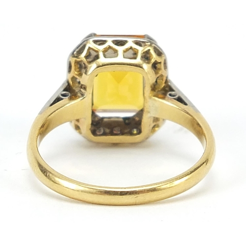 859 - 18ct gold orange stone and diamond ring, (tests as sapphire) size O, 4.6g