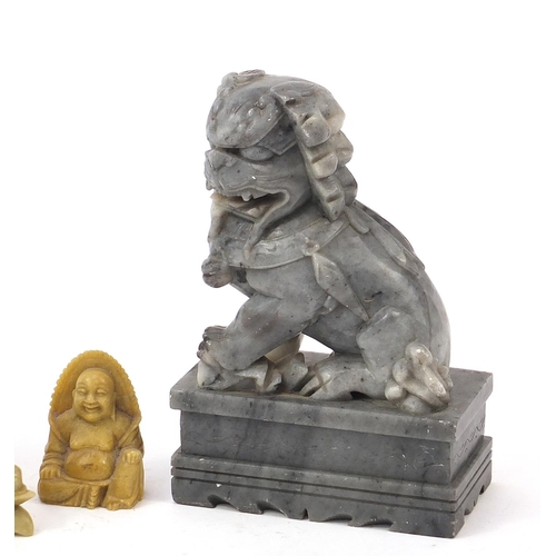 2548 - Chinese stone carvings including a pair of Foo dogs and a Buddha, the largest each 18cm high