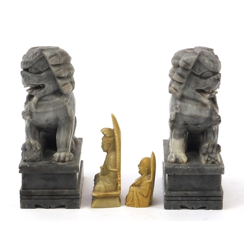 2548 - Chinese stone carvings including a pair of Foo dogs and a Buddha, the largest each 18cm high