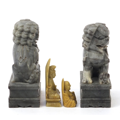 2548 - Chinese stone carvings including a pair of Foo dogs and a Buddha, the largest each 18cm high