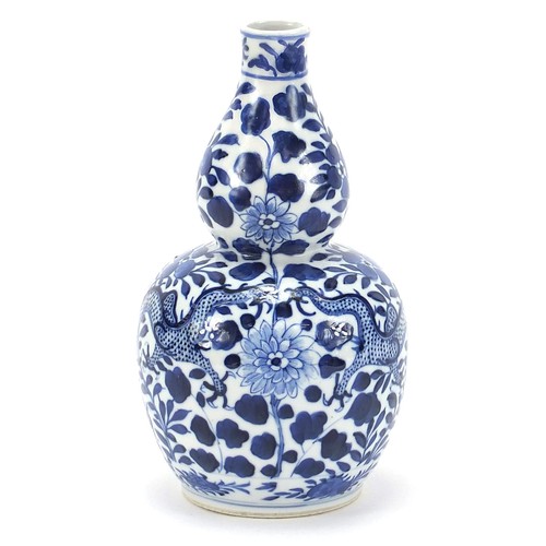 648 - Chinese blue and white porcelain double gourd vase hand painted with a dragon amongst flowers, four ... 