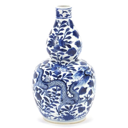 648 - Chinese blue and white porcelain double gourd vase hand painted with a dragon amongst flowers, four ... 