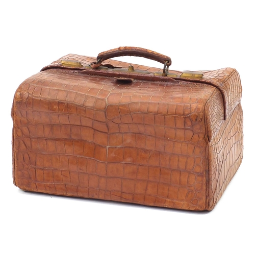 139 - Drew & Sons, Victorian crocodile skin travelling vanity case with a selection of silver mounted cut ... 