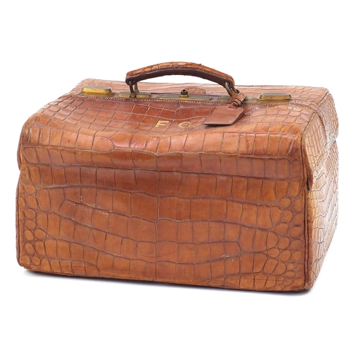 139 - Drew & Sons, Victorian crocodile skin travelling vanity case with a selection of silver mounted cut ... 